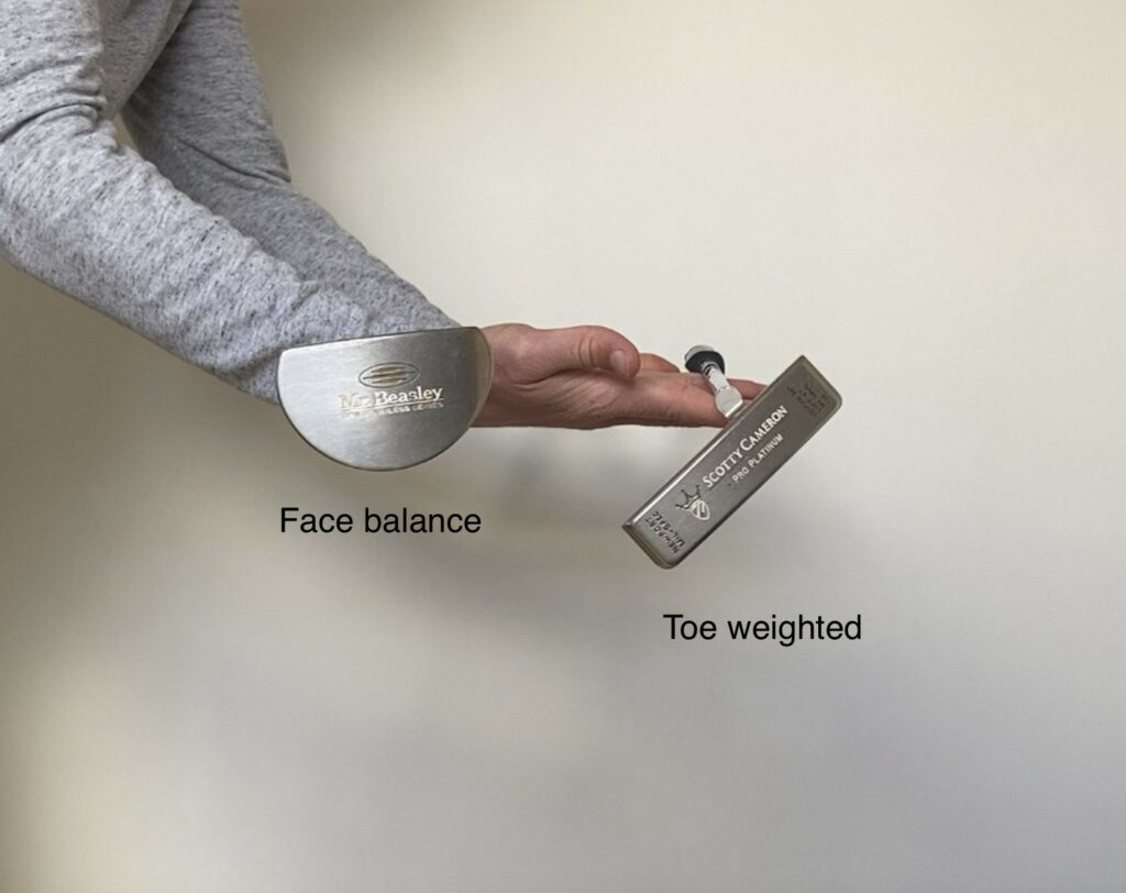 Face balanced vs toe weighted putters held to show how weight effects toe hang.